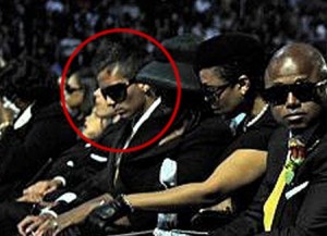 This photo of Omer Bhatti sitting with Michael Jackson's family at the memorial service is fueling speculation that he's Michael Jackson's 25-year-old son.