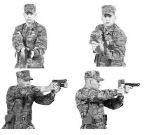flashlight_carry Be tactical. Imagine this is you, perhaps without the gun. (Photo: commons.wikimedia.org)