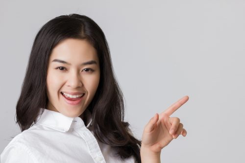 Woman with cash loans smiling