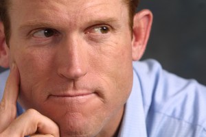 Man thinking Man thinking about getting a loan until payday