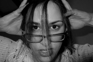 Woman stressed Are you struggling with a financial emergency? (photo by flickr)