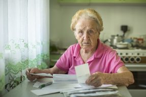 Elderly lady applying for a payday cash advance elderlly taking out advance payday loans
